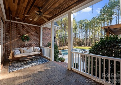 Timeless Southern charm meets lake living! Situated on a large on Trump National Golf Club Charlotte in North Carolina - for sale on GolfHomes.com, golf home, golf lot