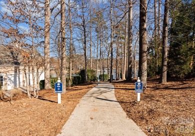 Timeless Southern charm meets lake living! Situated on a large on Trump National Golf Club Charlotte in North Carolina - for sale on GolfHomes.com, golf home, golf lot
