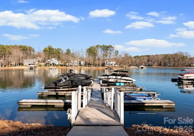 Timeless Southern charm meets lake living! Situated on a large on Trump National Golf Club Charlotte in North Carolina - for sale on GolfHomes.com, golf home, golf lot