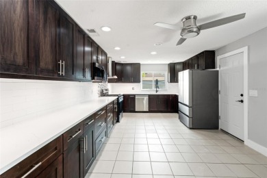 Tucked inside the coastal community of Shore Acres, this on Mangrove Bay Golf Course in Florida - for sale on GolfHomes.com, golf home, golf lot