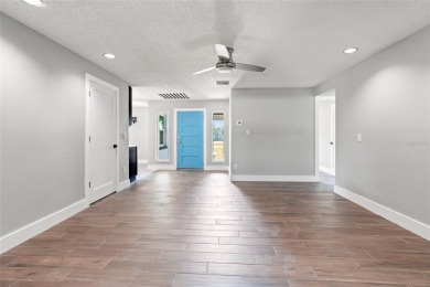 Tucked inside the coastal community of Shore Acres, this on Mangrove Bay Golf Course in Florida - for sale on GolfHomes.com, golf home, golf lot