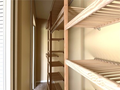 1ST FLOOR condo overlooking the fairway from the living room on The American Golf Club in Florida - for sale on GolfHomes.com, golf home, golf lot