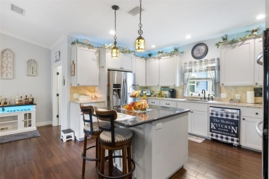 This beautifully designed stone home with blue and red accents on Lighthouse Golf Course in Texas - for sale on GolfHomes.com, golf home, golf lot
