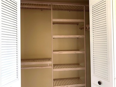 1ST FLOOR condo overlooking the fairway from the living room on The American Golf Club in Florida - for sale on GolfHomes.com, golf home, golf lot