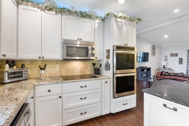 This beautifully designed stone home with blue and red accents on Lighthouse Golf Course in Texas - for sale on GolfHomes.com, golf home, golf lot