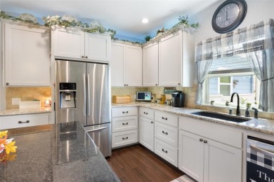 This beautifully designed stone home with blue and red accents on Lighthouse Golf Course in Texas - for sale on GolfHomes.com, golf home, golf lot