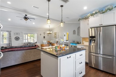 This beautifully designed stone home with blue and red accents on Lighthouse Golf Course in Texas - for sale on GolfHomes.com, golf home, golf lot