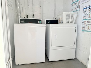 1ST FLOOR condo overlooking the fairway from the living room on The American Golf Club in Florida - for sale on GolfHomes.com, golf home, golf lot