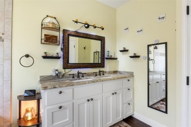 This beautifully designed stone home with blue and red accents on Lighthouse Golf Course in Texas - for sale on GolfHomes.com, golf home, golf lot