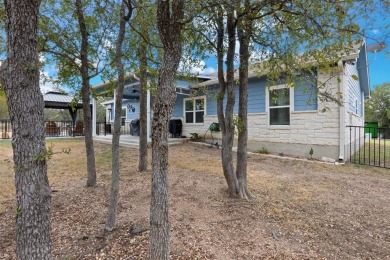 This beautifully designed stone home with blue and red accents on Lighthouse Golf Course in Texas - for sale on GolfHomes.com, golf home, golf lot