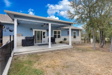 This beautifully designed stone home with blue and red accents on Lighthouse Golf Course in Texas - for sale on GolfHomes.com, golf home, golf lot
