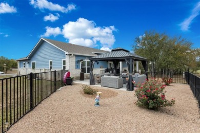 This beautifully designed stone home with blue and red accents on Lighthouse Golf Course in Texas - for sale on GolfHomes.com, golf home, golf lot