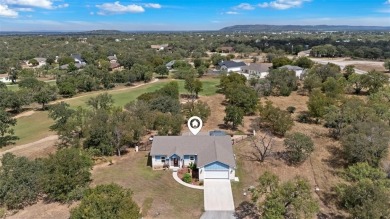 This beautifully designed stone home with blue and red accents on Lighthouse Golf Course in Texas - for sale on GolfHomes.com, golf home, golf lot