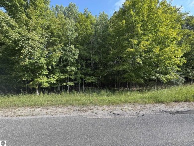 This 1.12-acre parcel features mature hardwoods and a gentle on Manitou Passage Golf Club in Michigan - for sale on GolfHomes.com, golf home, golf lot