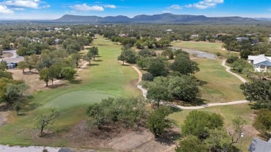 This beautifully designed stone home with blue and red accents on Lighthouse Golf Course in Texas - for sale on GolfHomes.com, golf home, golf lot