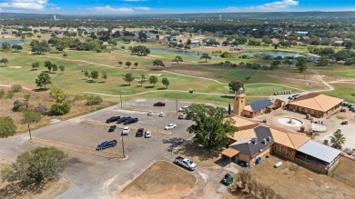 This beautifully designed stone home with blue and red accents on Lighthouse Golf Course in Texas - for sale on GolfHomes.com, golf home, golf lot