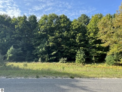This 0.81-acre parcel features mature hardwoods, open area near on Manitou Passage Golf Club in Michigan - for sale on GolfHomes.com, golf home, golf lot