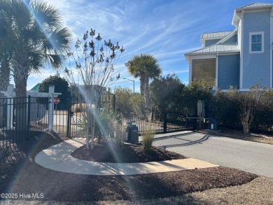 Situated in a private gated community overlooking one of Sunset on Oyster Bay Golf Links in North Carolina - for sale on GolfHomes.com, golf home, golf lot