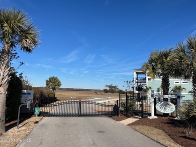 Situated in a private gated community overlooking one of Sunset on Oyster Bay Golf Links in North Carolina - for sale on GolfHomes.com, golf home, golf lot
