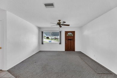 Pompano Beach Private Golf Community. 2 BR/BA with carport on Leisureville Community Association in Florida - for sale on GolfHomes.com, golf home, golf lot