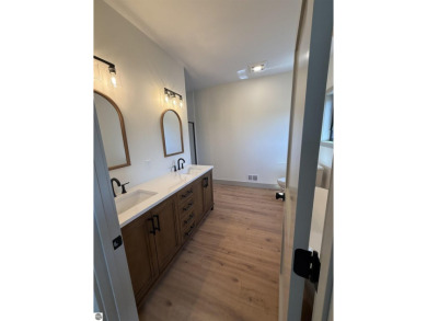 Come take a look at this brand new build with top level finishes on Mistwood Golf Course in Michigan - for sale on GolfHomes.com, golf home, golf lot
