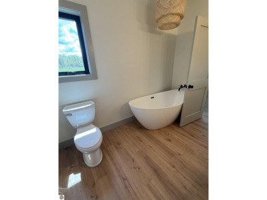 Come take a look at this brand new build with top level finishes on Mistwood Golf Course in Michigan - for sale on GolfHomes.com, golf home, golf lot