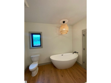 Come take a look at this brand new build with top level finishes on Mistwood Golf Course in Michigan - for sale on GolfHomes.com, golf home, golf lot