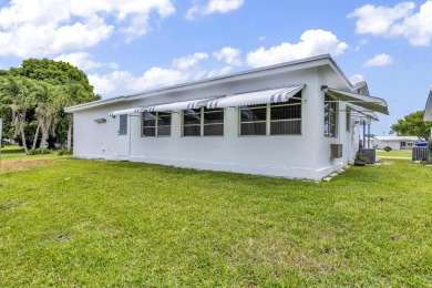 Pompano Beach Private Golf Community. 2 BR/BA with carport on Leisureville Community Association in Florida - for sale on GolfHomes.com, golf home, golf lot