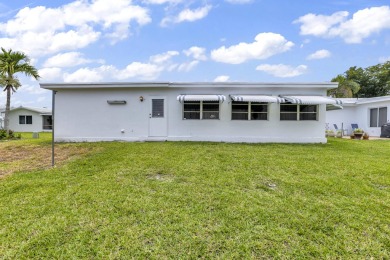 Pompano Beach Private Golf Community. 2 BR/BA with carport on Leisureville Community Association in Florida - for sale on GolfHomes.com, golf home, golf lot