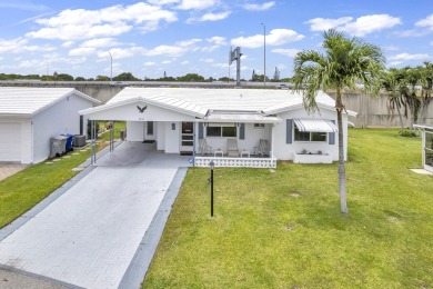 Pompano Beach Private Golf Community. 2 BR/BA with carport on Leisureville Community Association in Florida - for sale on GolfHomes.com, golf home, golf lot