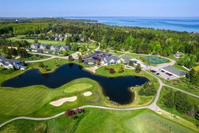 Tucked away next to the 9th hole of the Charlevoix Country Club on Charlevoix Golf and Country Club in Michigan - for sale on GolfHomes.com, golf home, golf lot