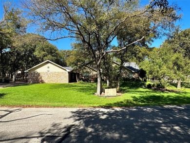 GORGEOUS CORNER LANDSCAPED DOUBLE LOT WITH LOTS OF TREES.This 2 on Pecan Plantation Country Club in Texas - for sale on GolfHomes.com, golf home, golf lot