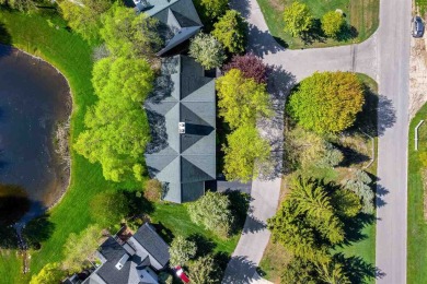 Tucked away next to the 9th hole of the Charlevoix Country Club on Charlevoix Golf and Country Club in Michigan - for sale on GolfHomes.com, golf home, golf lot