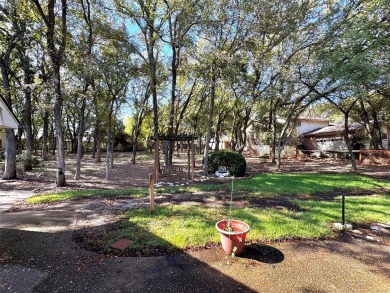 GORGEOUS CORNER LANDSCAPED DOUBLE LOT WITH LOTS OF TREES.This 2 on Pecan Plantation Country Club in Texas - for sale on GolfHomes.com, golf home, golf lot