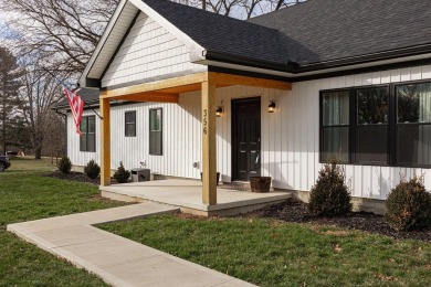 In 2021 this single-story home was custom-built on over half an on Mill Creek Golf Club in Ohio - for sale on GolfHomes.com, golf home, golf lot