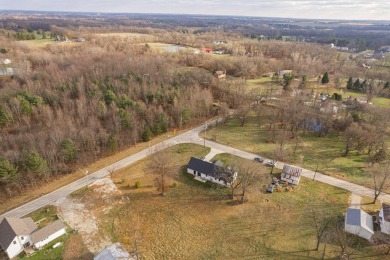 In 2021 this single-story home was custom-built on over half an on Mill Creek Golf Club in Ohio - for sale on GolfHomes.com, golf home, golf lot