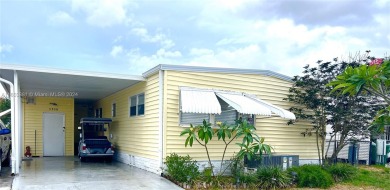 This stunning double-wide modern mobile home is located in a 55+ on Davie Golf Club in Florida - for sale on GolfHomes.com, golf home, golf lot