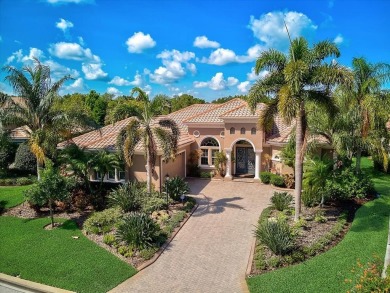 This spectacular home overlooks the #1 green on the Cypress on Lakewood Ranch Golf and Country Club in Florida - for sale on GolfHomes.com, golf home, golf lot