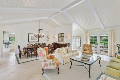 Nestled within lush landscaping and peaceful water views, this on Quail Ridge Golf Course and Country Club in Florida - for sale on GolfHomes.com, golf home, golf lot