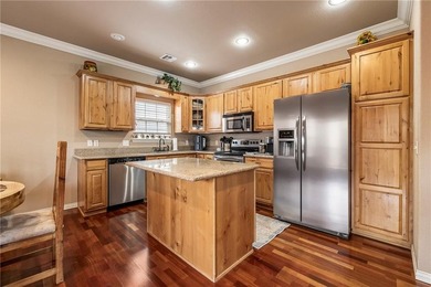 Enjoy easy living in this well-located home with walk-out on Bella Vista - Metfield Golf Complex and Country Club in Arkansas - for sale on GolfHomes.com, golf home, golf lot