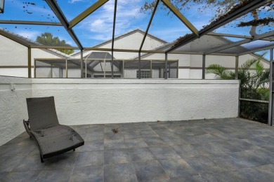 This charming villa in the Essex community offers serene water on Hunters Run Golf and Country Club in Florida - for sale on GolfHomes.com, golf home, golf lot