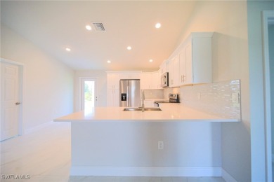 INTERSECTING CANAL VIEWS! You Will Be Amazed By The Quality Of on Mirror Lakes Golf Club in Florida - for sale on GolfHomes.com, golf home, golf lot