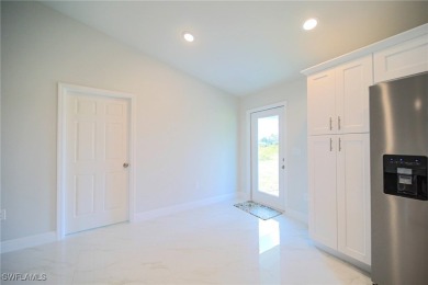 INTERSECTING CANAL VIEWS! You Will Be Amazed By The Quality Of on Mirror Lakes Golf Club in Florida - for sale on GolfHomes.com, golf home, golf lot