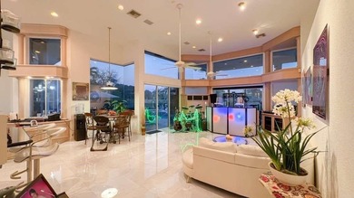 Panoramic golf and water views! Elegant home located on the 8th on TPC Eagle Trace in Florida - for sale on GolfHomes.com, golf home, golf lot