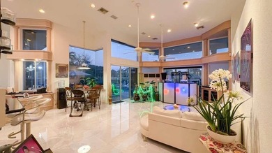 Panoramic golf and water views! Elegant home located on the 8th on TPC Eagle Trace in Florida - for sale on GolfHomes.com, golf home, golf lot