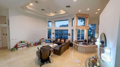 Panoramic golf and water views! Elegant home located on the 8th on TPC Eagle Trace in Florida - for sale on GolfHomes.com, golf home, golf lot