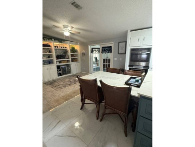 Indulge in expansive living within this magnificent double-wide on Hamptons Golf Club in Florida - for sale on GolfHomes.com, golf home, golf lot