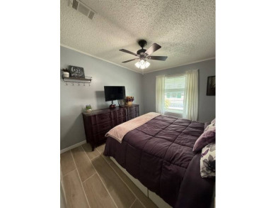 Indulge in expansive living within this magnificent double-wide on Hamptons Golf Club in Florida - for sale on GolfHomes.com, golf home, golf lot