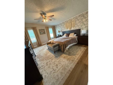 Indulge in expansive living within this magnificent double-wide on Hamptons Golf Club in Florida - for sale on GolfHomes.com, golf home, golf lot