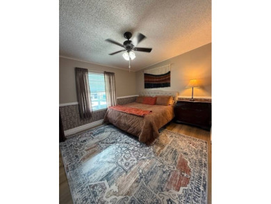 Indulge in expansive living within this magnificent double-wide on Hamptons Golf Club in Florida - for sale on GolfHomes.com, golf home, golf lot